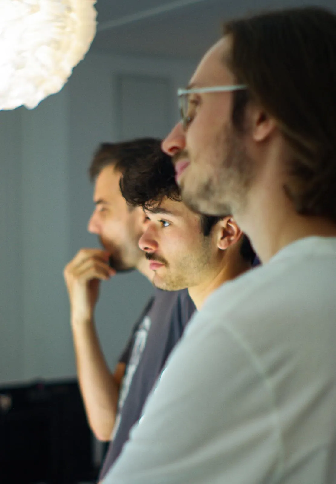 The Arkyan team gathered around a screen during a design session